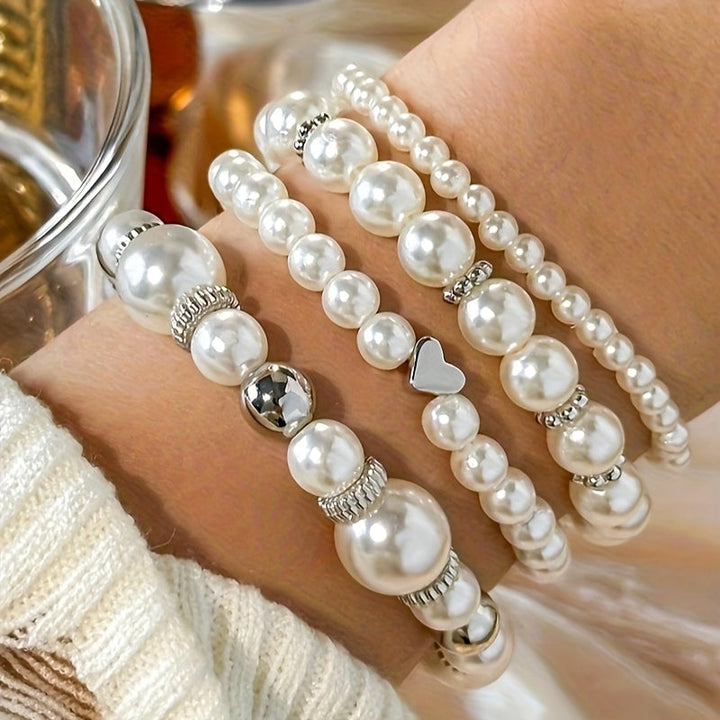 Set di bracciali con perle e cuore