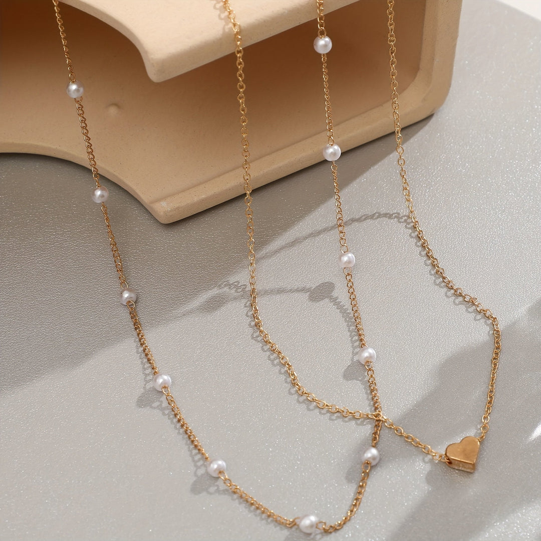 Set collana e bracciale con cuore e perle