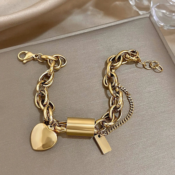 Bracciale dorato a maglie grandi con cuore