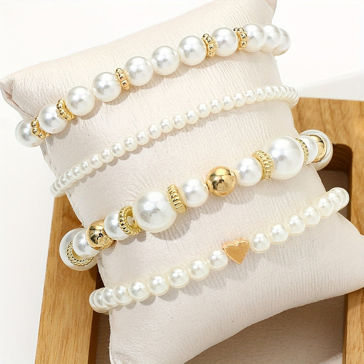 Set di bracciali con perle e cuore